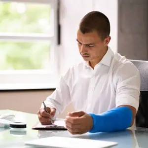 Man with arm cast filing for Compassionate Allowances